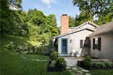 Landscape designer Dan Millner of Berkshire Hudson removed the overgrowth and revived the surrounding knoll. The windows, shudders, and doors were replaced, and the home got a fresh coat of paint.