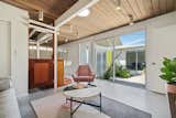 Another one of the home's open-air living spaces. "Being able to stand inside and watch the hummingbirds zipping around is magical,