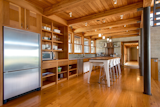 Kitchen, Dishwasher, Refrigerator, Microwave, Wood Cabinet, Ceiling Lighting, Drop In Sink, and Medium Hardwood Floor  Photo 5 of 5 in A Secluded Retreat in Washington Asks $1.45M by Sotheby’s International Realty