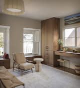 Custom millwork and shutters complement the original, leaded-glass windows. “We had been to the Getty Museum looking at some amazing wooden shutters there,” says the husband of the inspiration. A large silk Niba Designs rug provides a serene backdrop for the space.  Photo 1 of 198 in homes by Nialola from A Pair of Filmmakers Give Their San Francisco Edwardian a Sensuous Edit