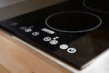 The kitchenette features a solar-powered induction stove. Optional smart tech lets you control it with an app.