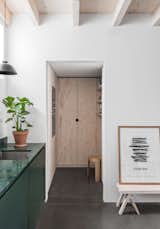 A small pantry is located off the kitchen, offering additional out-of-sight storage.  Photo 5 of 12 in Hem Founder Petrus Palmér Says “Adjö” to His Converted Blacksmith’s Workshop in Stockholm
