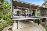 This case study-style home is located in San Luis Obispo, California—a coastal town situated roughly halfway between San Francisco and Los Angeles along the world-famous Highway 1 . An outdoor space stretches along the front of the stilted structure.  Photo 2 of 12 in A Case Study–Style Home in San Luis Obispo Lists for $870K