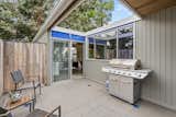 Outside, a cutout in the roof hangs over the enclosed patio area.  Photo 8 of 12 in A Case Study–Style Home in San Luis Obispo Lists for $870K
