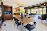The dining area features an original glass chandelier, as well as a corner bar with Venetian tile and more built-in Nutone appliances.  Photo 7 of 16 in A Restored Post-and-Beam by a Richard Neutra Protégé Lists for $700K
