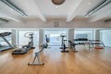The basement level offers a private gym with peekaboo views of the sea.