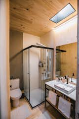 A skylight in the large, fully functional bathroom ushers in natural light.