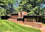 A front view of the home shows the long, horizontal orientation. The home was designed  Photo 3 of 5 in What You Need to Know About Frank Lloyd Wright’s Usonian Homes