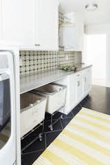 Lisac’s laundry room for a home in Aptos, California, includes a deep sink and rolling bins from Steele Canvas Basket Co. to keep up with washing for a family of six.