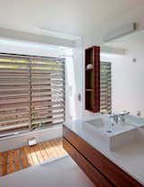 Bath Room, Granite Counter, Open Shower, Wall Lighting, and Vessel Sink  Photos from Vegetation Cocoons This Tranquil Beach House in Australia
