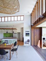 Dining, Ceiling, Table, Chair, Dark Hardwood, Bar, Stools, and Rug  Dining Chair Dark Hardwood Bar Photos from Vegetation Cocoons This Tranquil Beach House in Australia