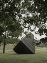 The cabin rests on the grounds of the New Art Centre in Salisbury, England, where it joins a multitude of sculptural artworks.