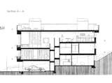 A cross-section drawing of the home shows the multiple levels and central stairwell.