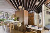The galley-style kitchen is defined by a wall of cabinetry and  Photo 6 of 15 in A John Lautner Post-and-Beam Hits the Market for the First Time Ever