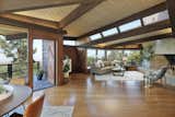 The home was recently modernized while retaining original design elements including the fireplace, clerestory windows, and extensive woodwork. Picture windows in the main living area provide views over Berkeley and the San Francisco Bay.  Photo 3 of 19 in An Alluring Berkeley Hills Home by a Case Study Architect Asks $2.9M