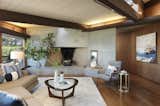 Another view of the living area shows the concrete fireplace, which is original to the 1964 home.  Photo 4 of 19 in An Alluring Berkeley Hills Home by a Case Study Architect Asks $2.9M