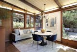 The breakfast area also looks out onto the patio.  Photo 9 of 19 in An Alluring Berkeley Hills Home by a Case Study Architect Asks $2.9M