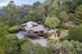 An aerial view of the property shows its secluded position along the hilltop.  Photo 18 of 19 in An Alluring Berkeley Hills Home by a Case Study Architect Asks $2.9M