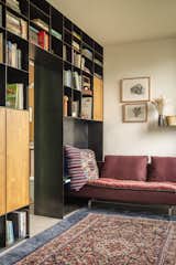 A custom bookcase provides a cozy nook and additional storage.