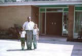 John and his two sons, Anthony and John Jr., in front of their Houston residence circa 1959.