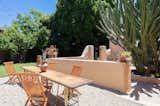 The approximately .20-acre lot also offers a grassy area at the back, as well as an additional outdoor dining area.  Photo 19 of 20 in The Restored L.A. Home of Poet Alice Lynch Is a Rad Option If Your Budget Stretches to $1.8M