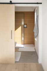 In total, the home also offers three-and-a-half bathrooms. Each of the guest bathrooms are finished in the brightly colored tile.