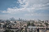 A view of the London skyline from the western side of the apartment.  Photo 11 of 11 in A Penthouse Apartment in a London Water Tank Offers Utilitarian Style for $781K