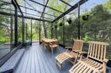 A closer look at the solarium. The glass-enclosed space opens to small decks at both ends.