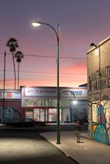 An artists rendering conveys a use case in an L.A. neighborhood, where two offset poles cast broad and varied light. At the top, a rainbow of LED lighting provides ambiance, and can alert of an emergency.  Photo 3 of 7 in Project Room’s Winning Streetlight Design Beckons a Brighter Future for Los Angeles