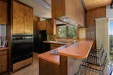 The kitchen features the original cabinetry and formica countertops.