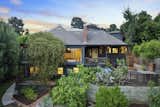 The two-level home follows the sloping lot with multiple patios, decks, and porches to enjoy the outdoors.  Photo 24 of 24 in Asking $3.75M, This Bohemian Hillside Home in L.A. Comes Complete With a Potter’s Studio