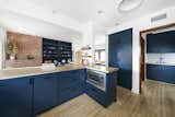 A large pass-through in the kitchen connects the space with a smaller breakfast area on the other side.  Photo 7 of 24 in Asking $3.75M, This Bohemian Hillside Home in L.A. Comes Complete With a Potter’s Studio