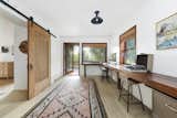 Pieces of timber run along a wall to create an expansive work area in the office.  Photo 15 of 24 in Asking $3.75M, This Bohemian Hillside Home in L.A. Comes Complete With a Potter’s Studio
