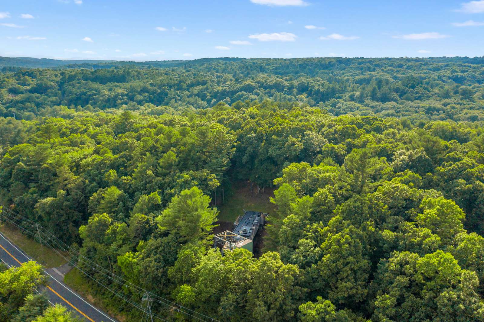 photo-17-of-17-in-a-bridge-like-home-suspended-above-a-connecticut