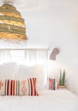 The bedroom of Casita Coyote, an Airstream by Kim Lewis Designs, with a pillow from Made Trade.&nbsp;
