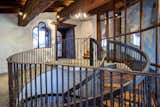 One one side of the home, a spiral staircase leads down to the lower level. Some of the home's custom railings were refinished/replaced during the recent renovation.  Photo 9 of 15 in Listed for $2.65M, This Bavarian-Style “Snow Haus” Near Lake Tahoe Is the Perfect Alpine Escape
