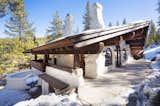 Among the outdoor spaces are a large patio off of the living area and a massive sunken fire pit— shown here at the bottom corner of the home.  Photo 14 of 15 in Listed for $2.65M, This Bavarian-Style “Snow Haus” Near Lake Tahoe Is the Perfect Alpine Escape