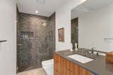 Each of the three full bathrooms share similar finishes, added during the 2019 renovation.  Photo 15 of 17 in A Palm Springs Alexander Home Sings After a Chic Renovation and Hits the Market to the Tune of $2.1M