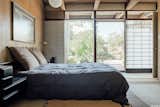 Another view of the bedroom shows more of the screens along the window wall.  Photo 10 of 18 in This Tranquil, Japanese-Inspired Midcentury Home Asks $1.2M