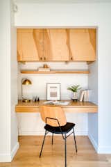 A built-in office nook sits opposite the kitchen island.