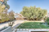 As seen from the front porch, the approximately 5,719-square-foot lot also features a small front lawn set back from the street.  Photo 15 of 15 in In Los Angeles, a Remixed Craftsman Bungalow Lists for $1.9M