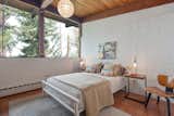 Both bedrooms are brightly illuminated by windows that span the width of each room.