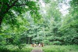 The fire pit was fashioned with stones found on the property, and the couple built the Adirondack chairs themselves using some plans they found online.