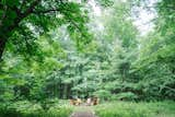 The fire pit was fashioned with stones found on the property, and the couple built the Adirondack chairs themselves using some plans they found online.