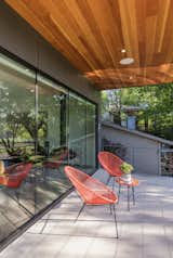 The second story provides cover for a patio along the front of the home. Gooden and his team tied the windows into the facade by aligning the cement fiber board cladding with the joints between each pane of glass.