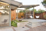 A concrete patio extends from the family room.