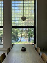 The dining area looks out onto views of the creek and marshland across the water.