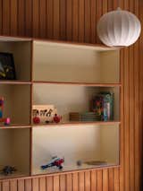 Another bedroom offers recessed bookshelves.