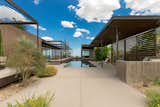 Along one side of the home, a poolside patio and several covered pavilions provide additional space for relaxing or entertaining.  Photo 10 of 12 in Asking $10.5M, This Desert Prefab by Marmol Radziner Doesn’t Want for “Wow” Factor