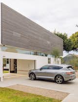 A Genesis GV80 sits in front of the Lais’ Japanese-inspired modern home in Culver City.

Preproduction model with optional features shown. 